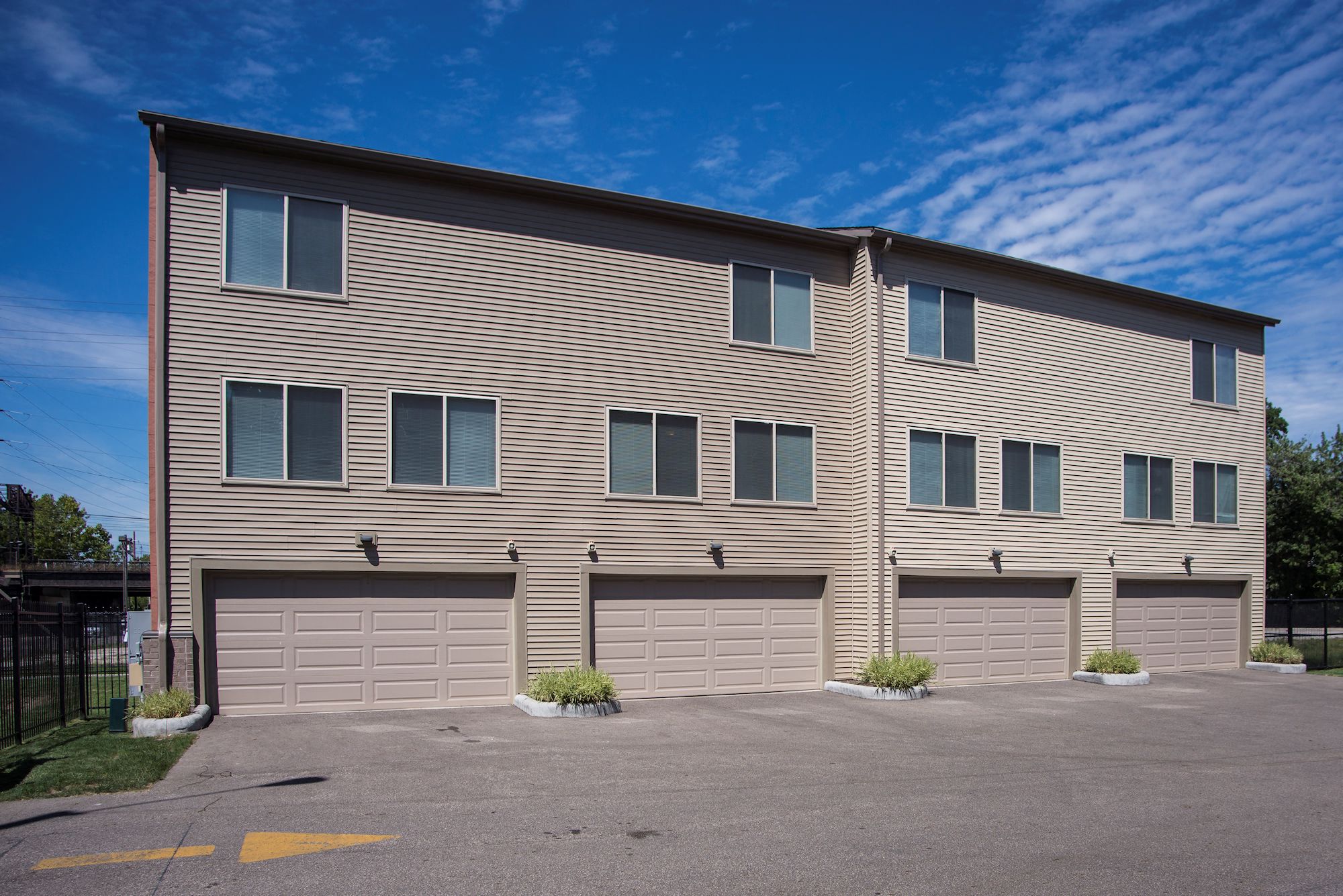 a building with two garage doors on the side of it
