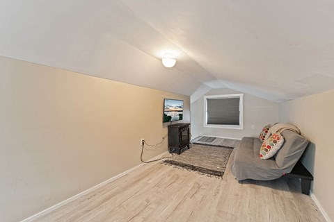 a living room with a couch and a tv