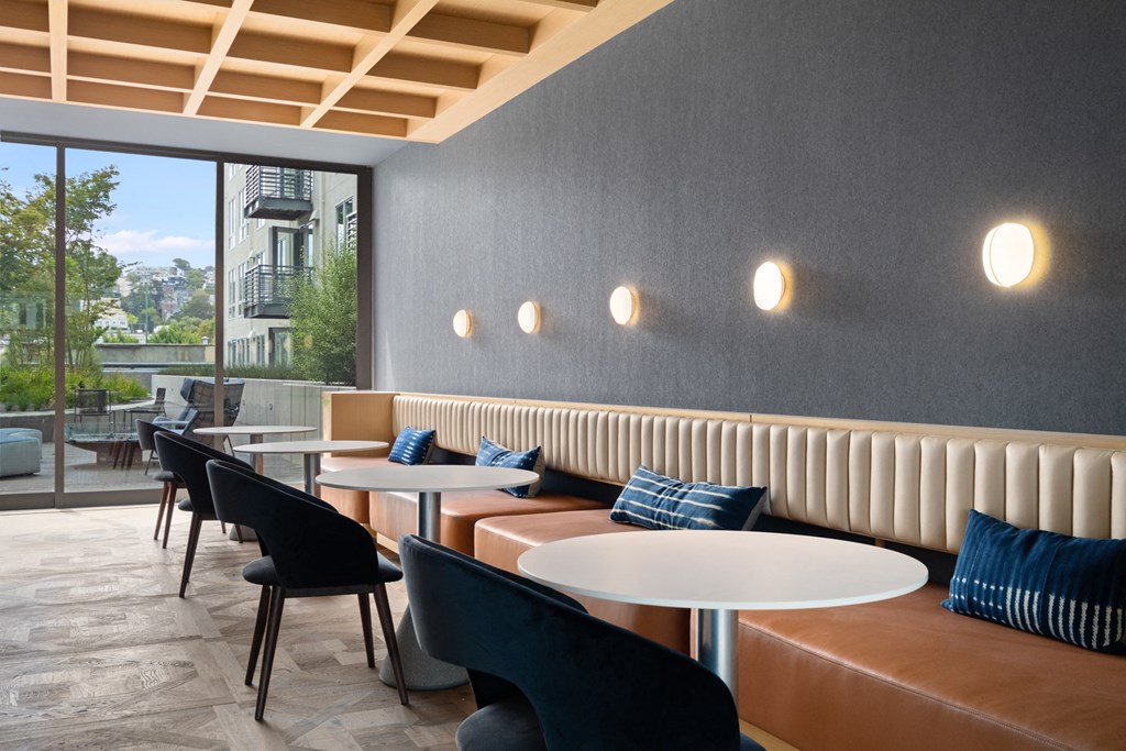 a restaurant with tables and chairs and a large window