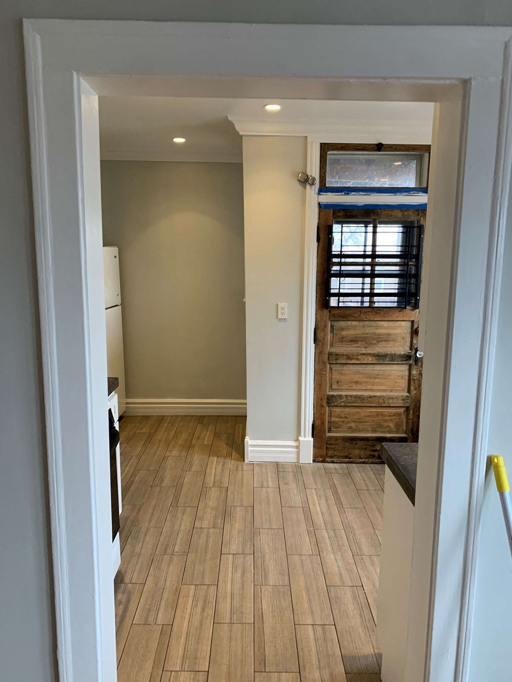 a room with a wooden floor and a door