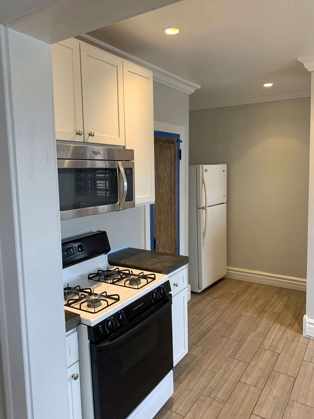 a kitchen with a stove and a refrigerator