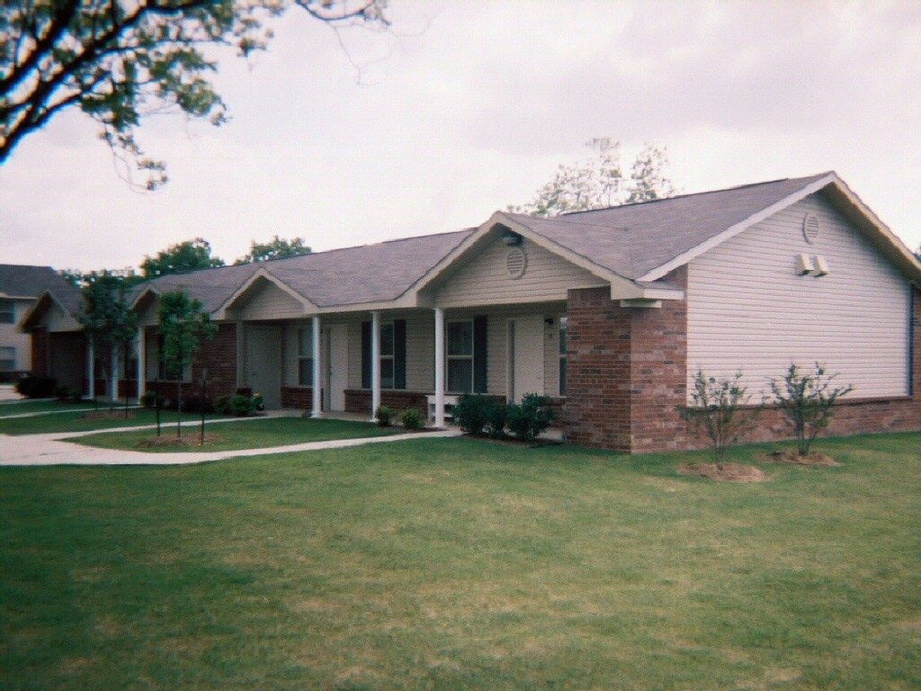 a house with a yard in front of it