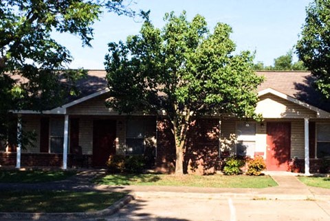 a house with a tree in front of it