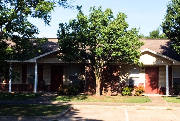 a house with a tree in front of it
