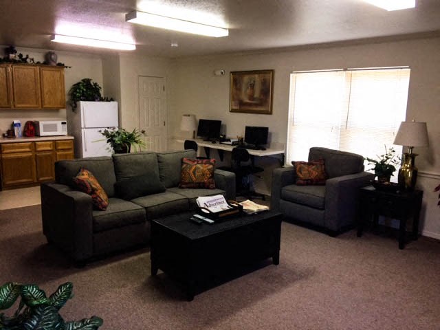 a living room with couches and a coffee table
