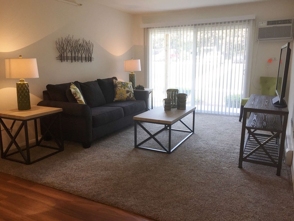 a living room with a couch and a table