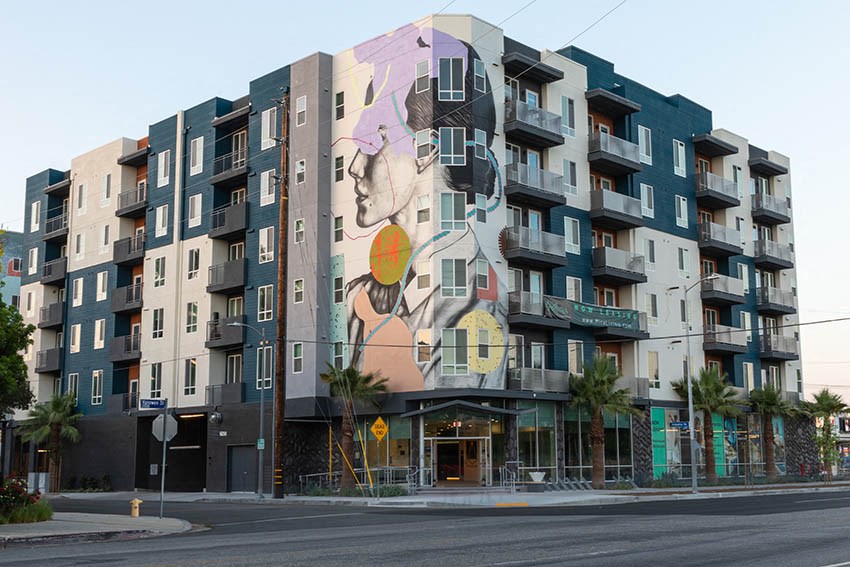 a mural of a woman on the side of a building
