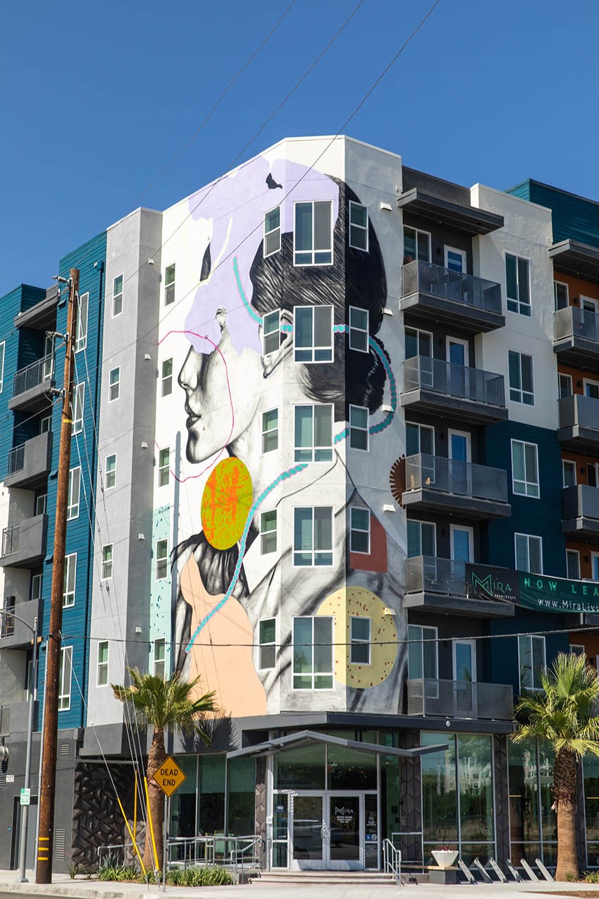 a mural of a woman on the side of a building