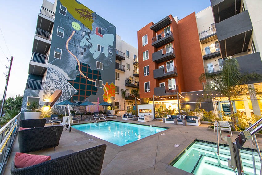a swimming pool in the middle of an apartment building