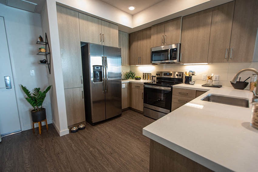a kitchen with a refrigerator and a sink