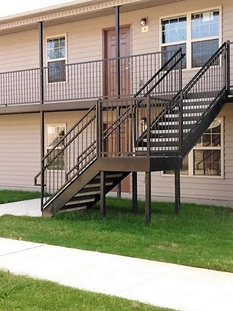 a pair of stairs in front of a building