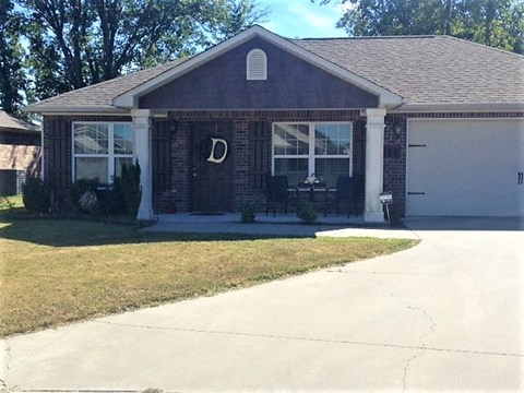 a house with a sidewalk in front of it