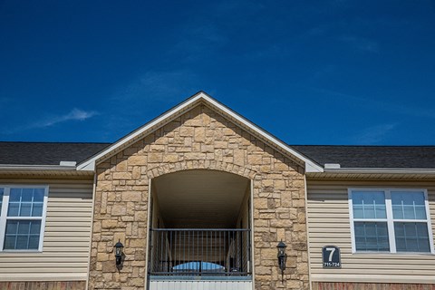 the front of a house with an open door