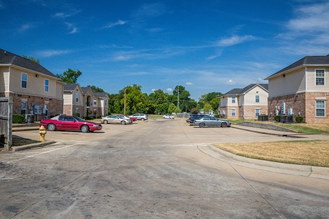 an empty street in a suburban neighbourhood with a fire hydrant