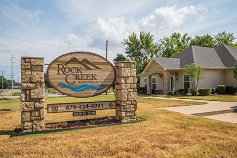 a sign estates in front of a house