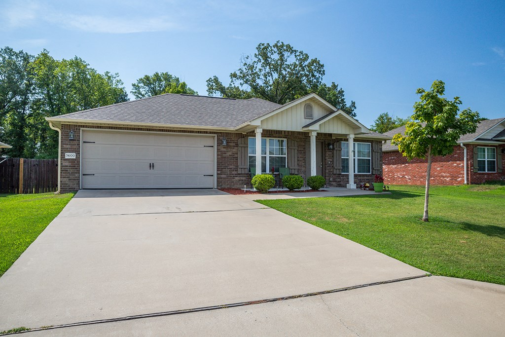 a house with a driveway and a garage door