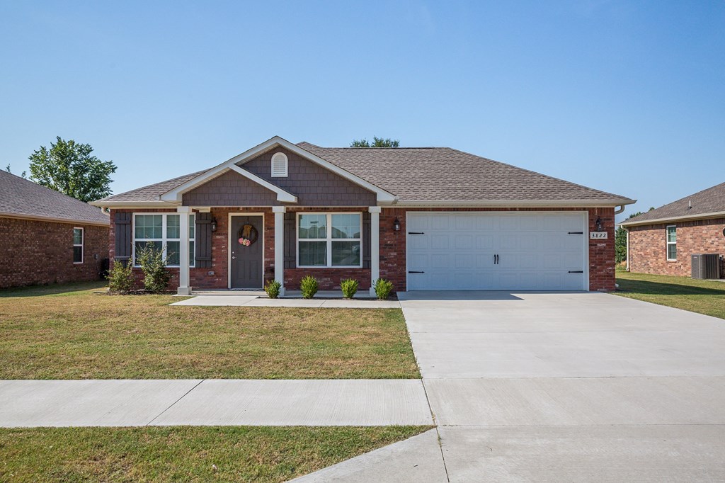 a house with a driveway and a garage door