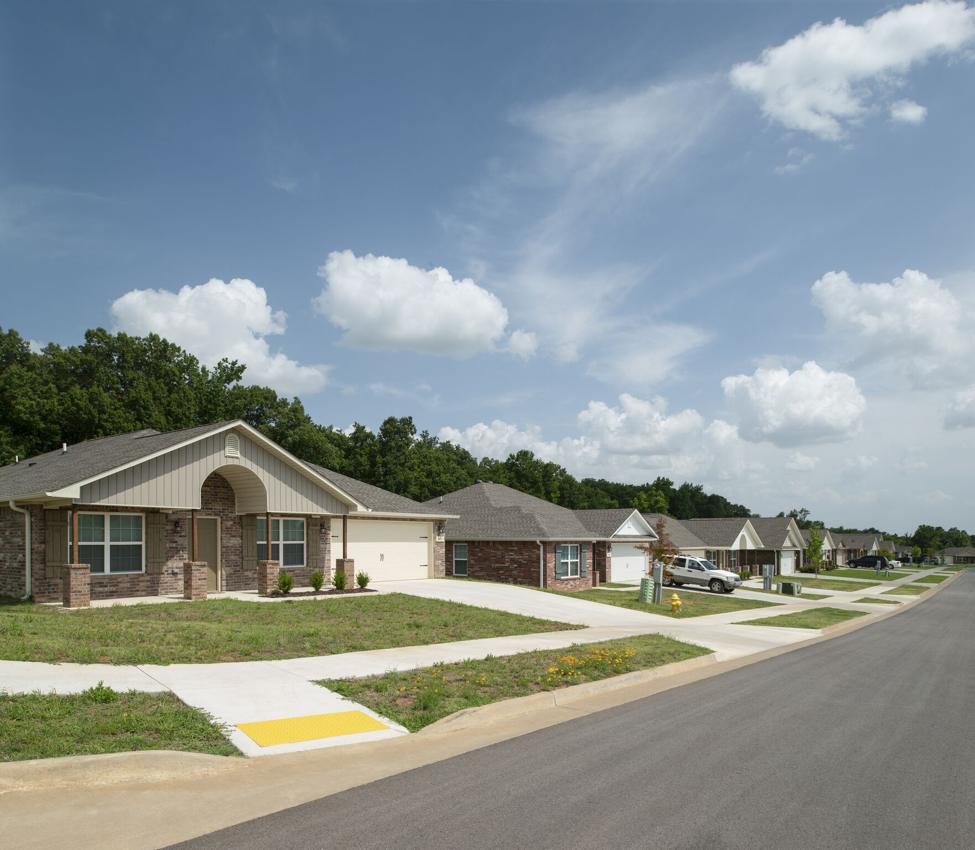 a neighborhood of manufactured homes on a street