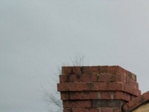 a stone brick sign with the stone brook logo on it