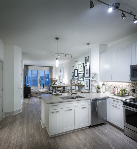 a kitchen with a large center island and a sink