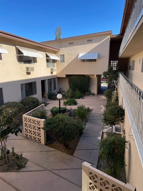 a view of the courtyard from the balcony of a building