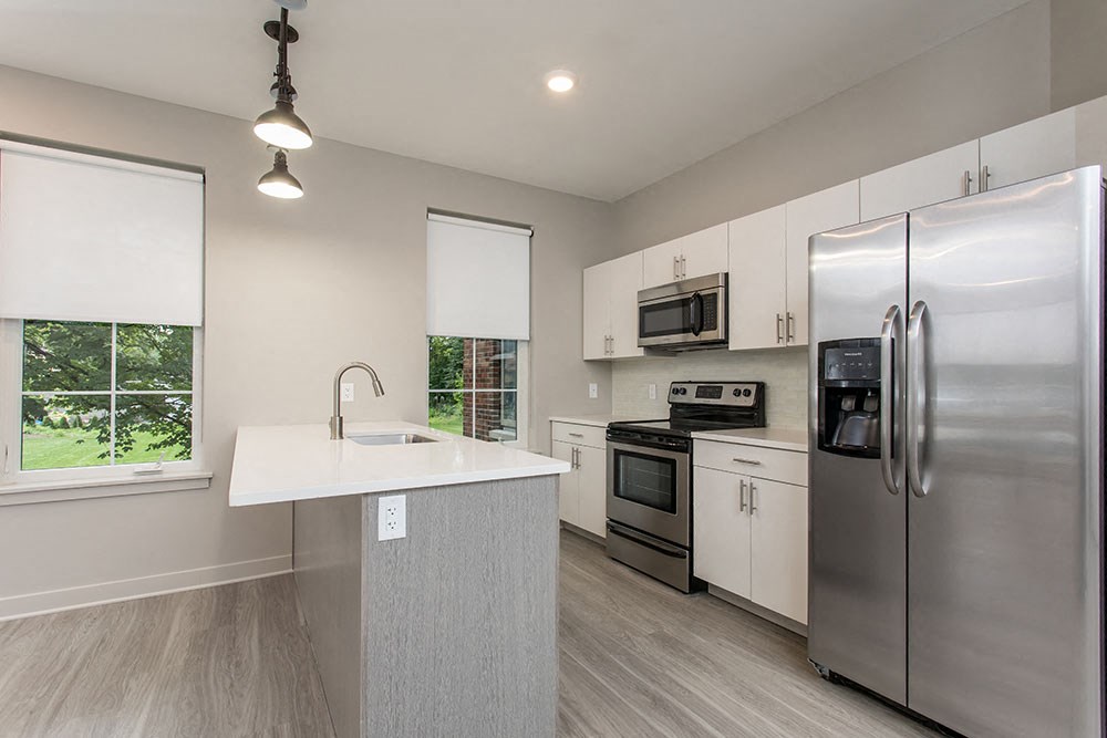 a kitchen with stainless steel appliances and a counter top