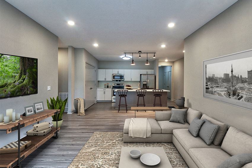 a large living room with a couch and a table