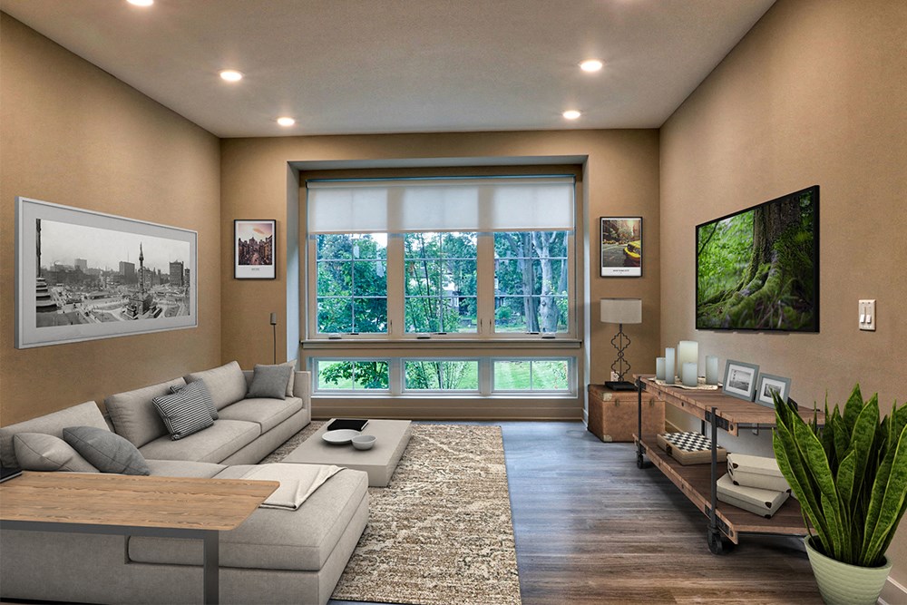 a living room with a large window and a couch and a table