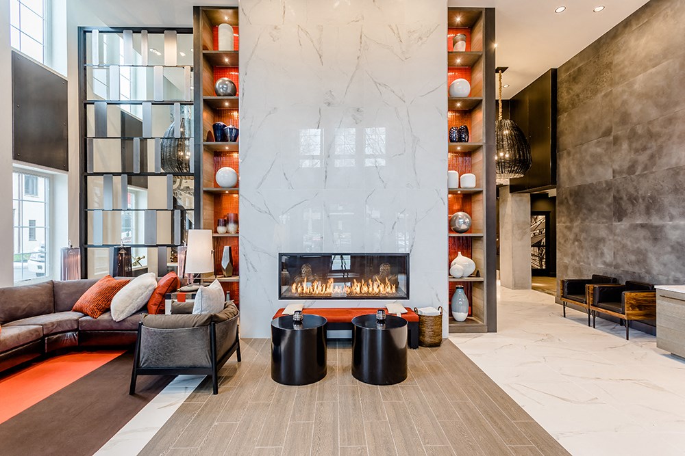 a living room with couches and a fireplace