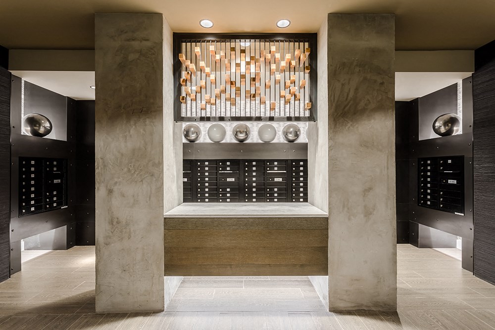 a large wine cellar with a marble counter and a wall of wine glasses and bottles