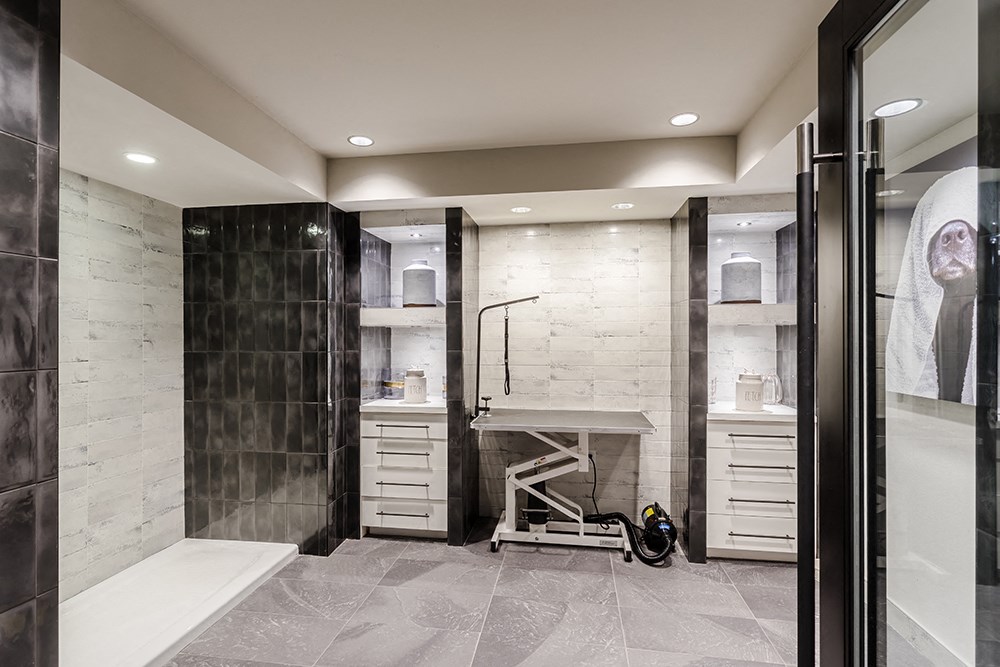 a bathroom with a shower and a wheelchair in it