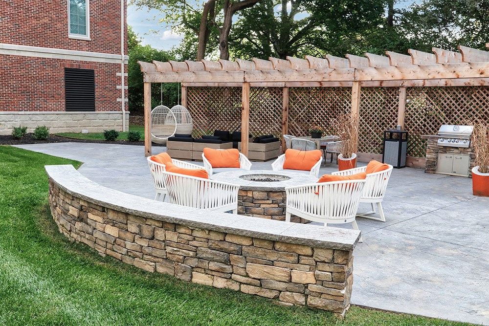 a patio with a seating area and a pergola