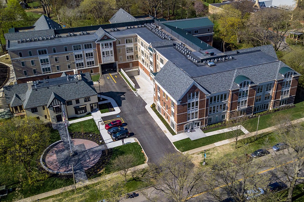 an aerial view of a building and a parking lot