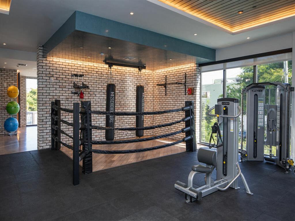 weighted machines and punching bags in fitness center
