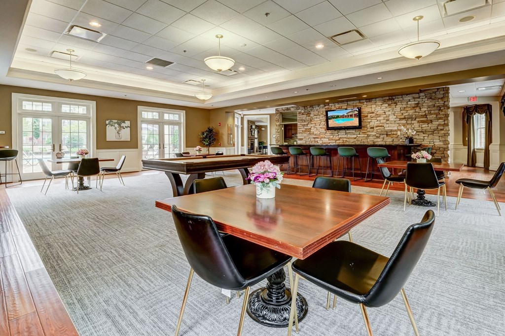 a conference room with a bar and tables