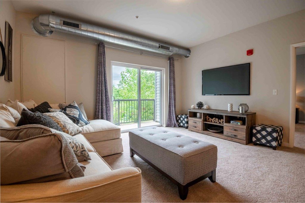 a living room with a couch and a tv