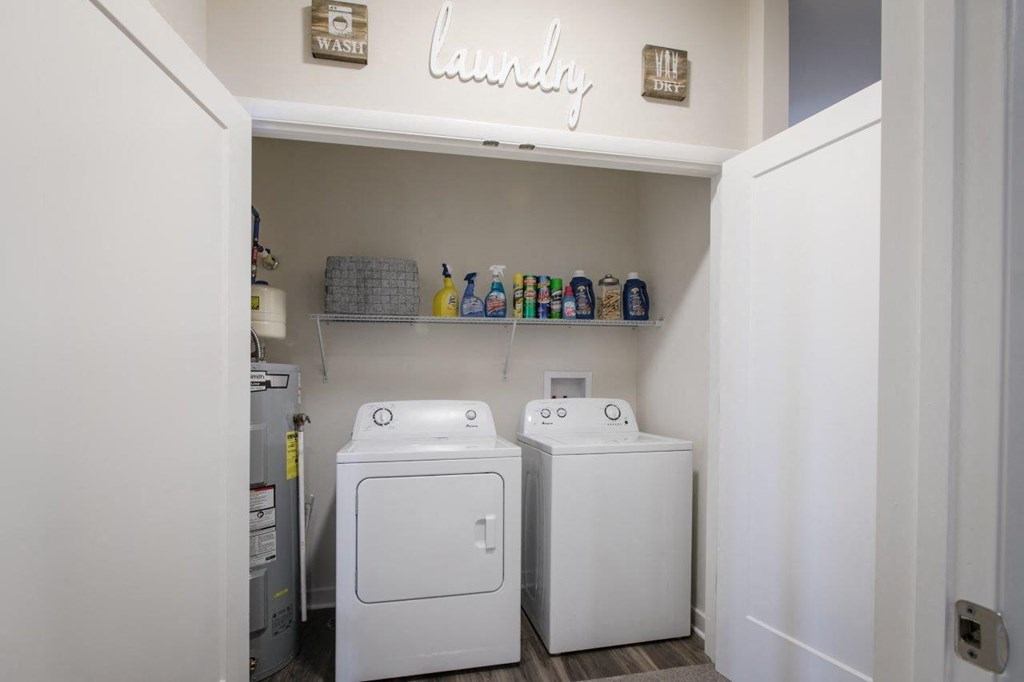 a white washer and dryer in a laundry room