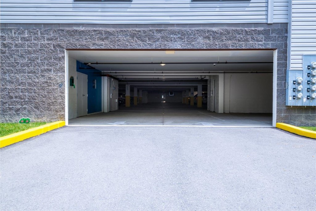 a large open garage door with the entrance to a building