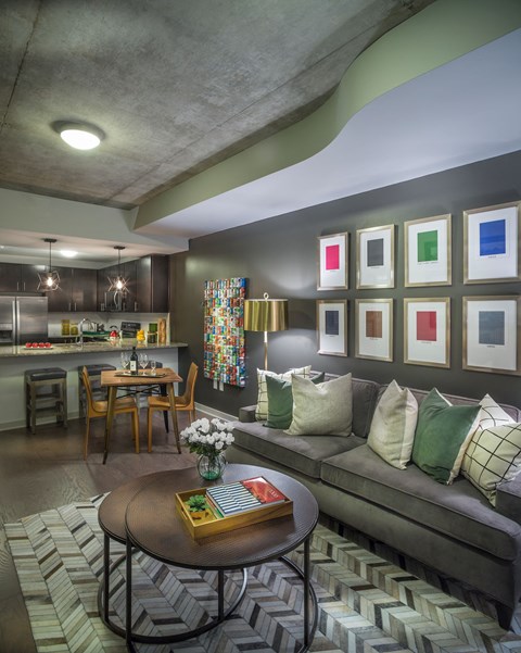 A living room with a grey couch and a coffee table.