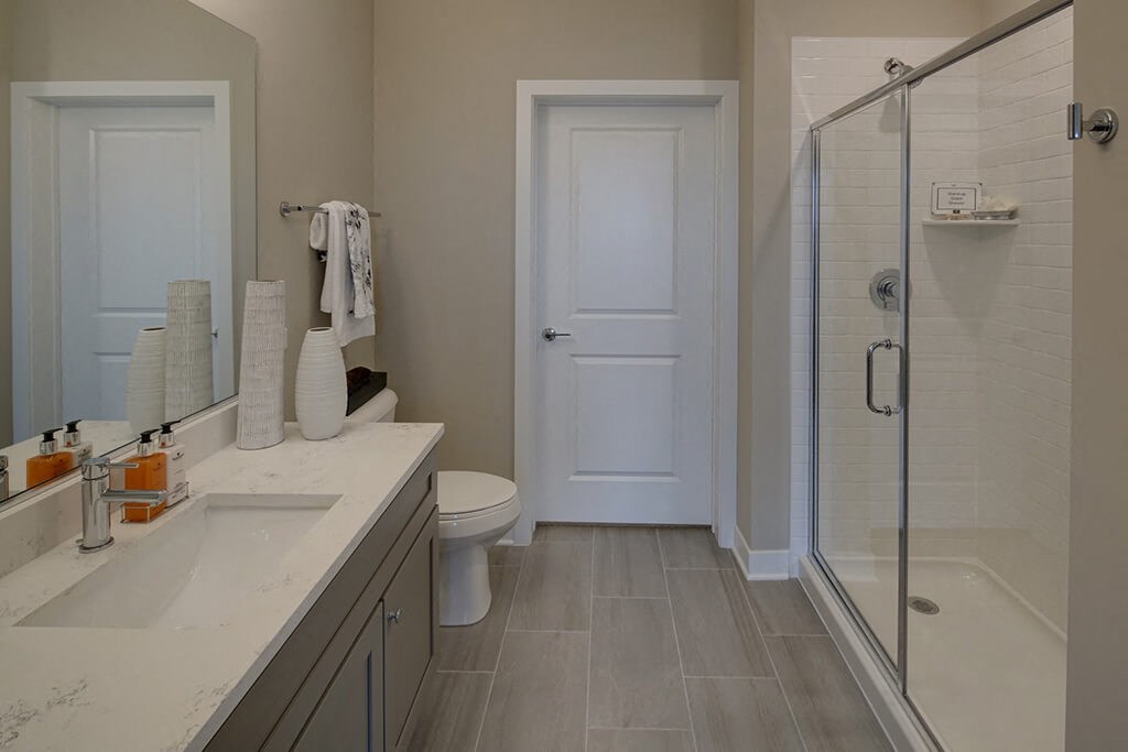 Renovated Bathrooms With Quartz Counters at Marq on Main, Illinois