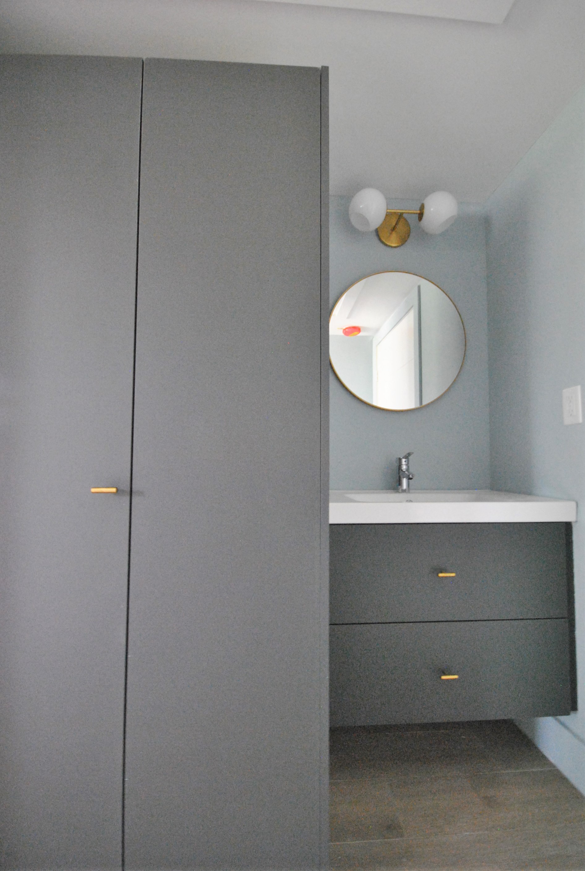 a small bathroom with a sink and a mirror