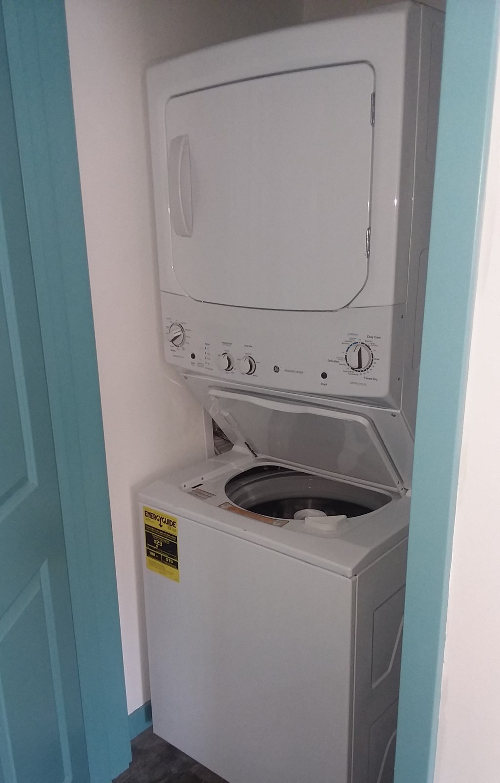 a washer and dryer in a room with a door