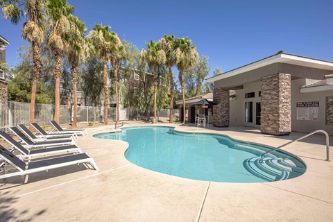 Outdoor pool with lounge chairs
