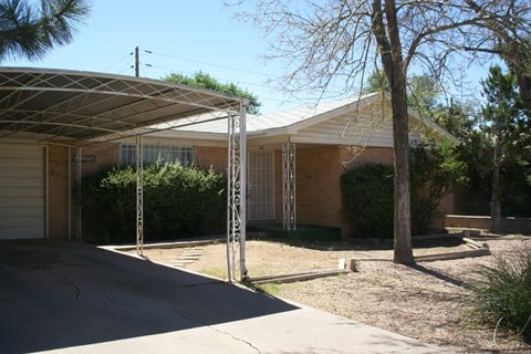 a house with a covered porch in front of it