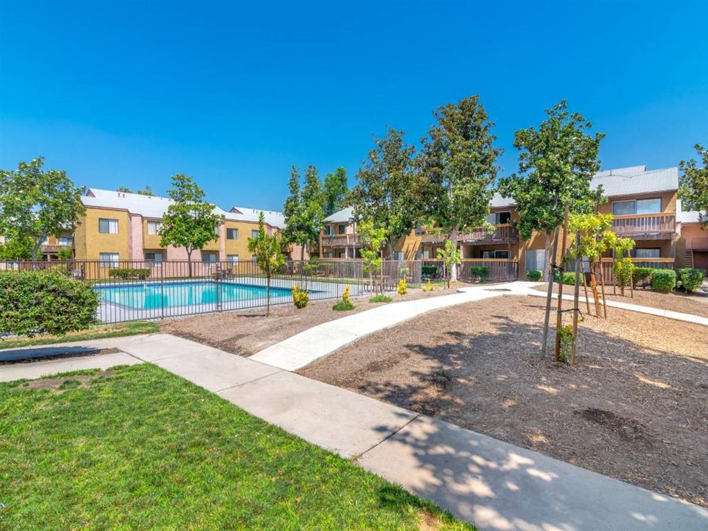 our apartments have a pool and trees in front of them
