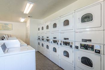 laundry room with many machines
