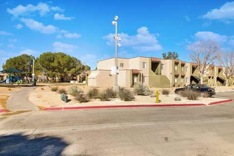 a building with a yellow fire hydrant in front of it
