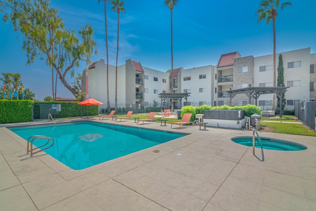 our apartments have a swimming pool and a patio with chairs