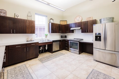 a kitchen with stainless steel appliances and wooden cabinets