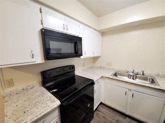 Image of a fully-equipped kitchen with energy efficient appliances.